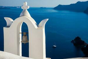 Traditional architecture of the churches of the Oia City in Santorini Island photo