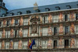 Beautiful antique buildings around Plaza Mayor at Madrid city center photo