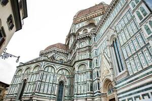 Facade of the beautiful Florence Cathedral consecrated in 1436 photo