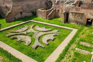 Courtyard garden of the ancient ruins of the Domus Augustana on Palatine Hill in Rome photo