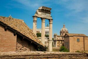 Remains of the Temple of Castor and Pollux or the Dioscuri at the Roman Forum in Rome photo