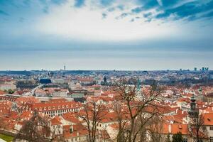 The beautiful Prague city old town seen form the Prague Castle viewpoint in an early spring day photo