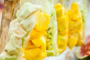 Close up of bags of mango and guava pieces photo