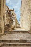 The beautiful steep alleys at the walled old town of Dubrovnik photo