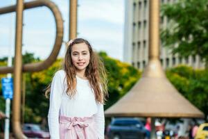 Beautiful young girl at the Jairo Varela Square in the city of Cali in Colombia photo