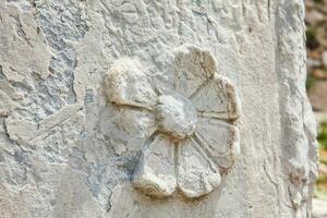 Detail of the carvings at the ancient ruins on the Roman Agora located to the north of the Acropolis in Athens photo