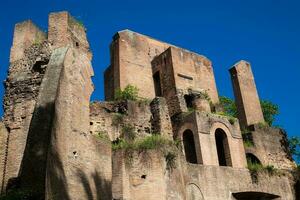 Ruins of an antique monumental fountain called Trofei di Mario built in 226 AD and  located at Piazza Vittorio Emanuele II in Rome photo