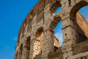 Detail of the  facade of the famous Colosseum or Coliseum also known as the Flavian Amphitheatre in the centre of the city of Rome photo