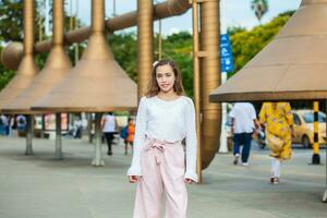 Beautiful young girl at the Jairo Varela Square in the city of Cali in Colombia photo