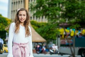 Beautiful young girl at the Jairo Varela Square in the city of Cali in Colombia photo