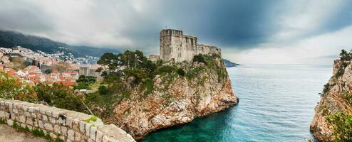 Dubrovnik city and the Medieval Fort Lovrijenac located on the western wall photo