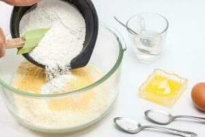 Pandebono preparation. Adding cassava starch for pandebono dough photo