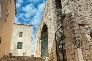 The beautiful steep alleys at the walled old town of Dubrovnik photo