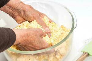Pandebono preparation. Hand kneading pandebono dough photo