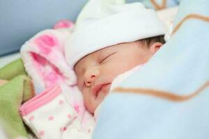 Newborn girl in the hospital on the day of her birth photo