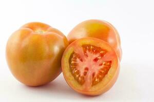 Tomato isolated in white background. Lycopersicon esculentum photo