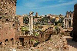 Remains of the Temple of Castor and Pollux or the Dioscuri at the Roman Forum in Rome photo