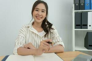 working woman, Portrait of smiling Asia girl in work clothes, sit at office and doing research, copy space, happy cheerful cute business, positive energy, Business plan, female executive photo
