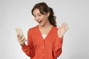 beautiful woman exited surprise face expression . female feels shocked with the phone. exciting smile and happy adorable rejoices. Very enjoy and fun relax time. wow, girl holding smartphone. photo