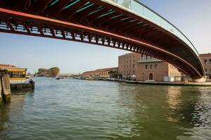 Constitution Bridge over the Grand Canal in Venice in a beautiful early spring day photo