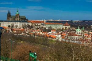 Prague Cathedral and city seen from Petrin Hill in a beautiful early spring day photo
