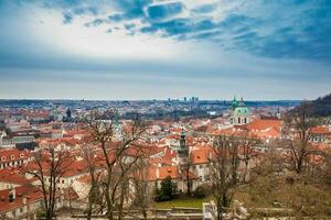 The beautiful Prague city old town seen form the Prague Castle viewpoint in an early spring day photo