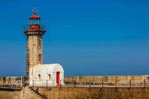 Beautiful early spring day at the historical Felgueiras Lighthouse built on 1886 and located at Douro river mouth in Porto city photo