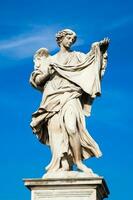 Beautiful Angel with the Sudarium statue created by Cosimo Fancelli on the 16th century at Sant Angelo Bridge in Rome photo