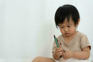 Happy Asia children playing learning paint on paper. Activity, development, IQ, EQ, meditation, brain, muscles, essential skills, family having fun spending time together. Holiday photo