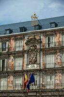 Beautiful antique buildings around Plaza Mayor at Madrid city center photo