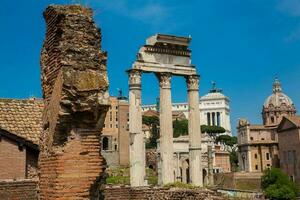 Remains of the Temple of Castor and Pollux or the Dioscuri at the Roman Forum in Rome photo