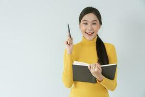 Portrait beautiful Asian woman student. Smile girl happy study. read book in college campus. young female on international Asia University. Education, study, school, learning, exam, continue education photo