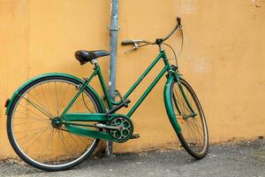 Parked bicycle at the beautiful streets of Pisa photo