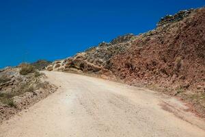 caminando sendero número 9 9 Entre el ciudades de fira y oia en el santorini isla foto