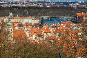Manes Bridge and Prague old town seen from the Petrin hill photo