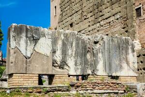Ancient stone inscriptions at the entrance to the Basilica Aemilia at the Roman Forum in Rome photo