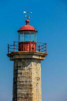 Beautiful early spring day at the historical Felgueiras Lighthouse built on 1886 and located at Douro river mouth in Porto city photo