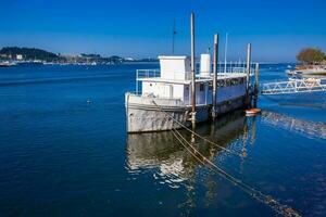 Old ship at Douro River mouth in a beautiful early spring day at Porto City in Portugal photo