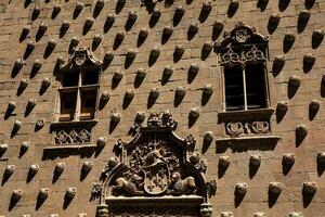 Detail of the historical House of the Shells built in 1517 by Rodrigo Arias de Maldonado knight of the Order of Santiago de Compostela in Salamanca, Spain photo