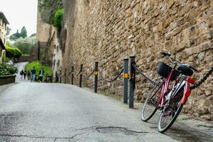 Bicycle parked at the beautiful streets of Florence old city photo