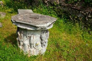 Remains of columns of the ancient buildings at the Roman Forum in Rome photo