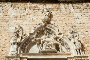 Detail of Stone Carving in the Franciscan Monastery located at Stradun street in Dubrovnik Old Town photo