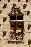 Detail of the windows of the historical House of the Shells built in 1517 by Rodrigo Arias de Maldonado knight of the Order of Santiago de Compostela in Salamanca, Spain photo