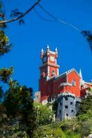 The Pena Palace seen from the Gardens of Pena Park at the municipality of Sintra photo