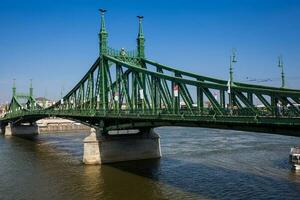 Liberty Bridge or Freedom Bridge over the Danube river in Budapest photo