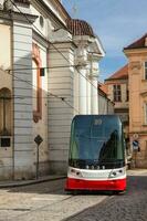 Tram and the beautiful architecture at Prague old town photo