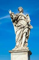 Beautiful Angel with the Nails statue created by Girolamo Lucenti on the 16th century at Sant Angelo Bridge in Rome photo