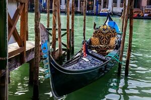 Beautiful traditional gondola at Venice canals photo