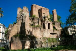 Ruins of an antique monumental fountain called Trofei di Mario built in 226 AD and  located at Piazza Vittorio Emanuele II in Rome photo