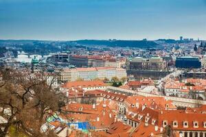 The beautiful Prague city old town seen form the Prague Castle viewpoint in an early spring day photo